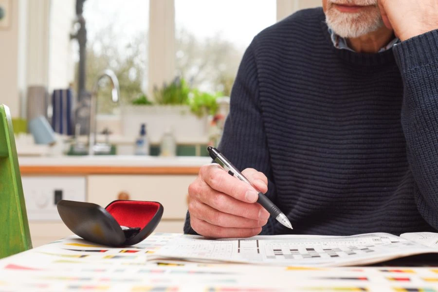 Man doing a crossword puzzle